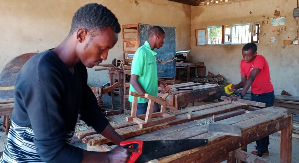 Deaf youth learning carpentry at a vocational training college in Tabora, Tanzania. 