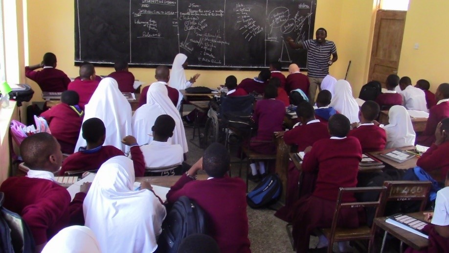 Deaf students amidst hearing students in an inclusive classroom setting in Tabora, Tanzania