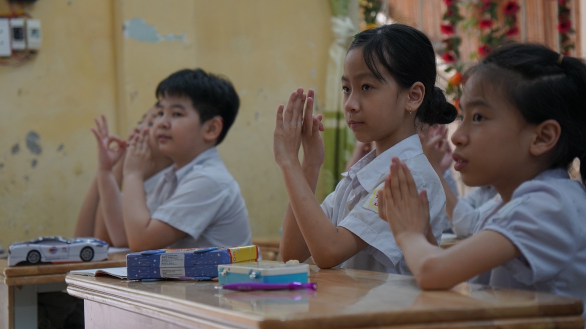 Students signing during a lesson at Xa Dan school for deaf children in Ha Noi, Viet Nam