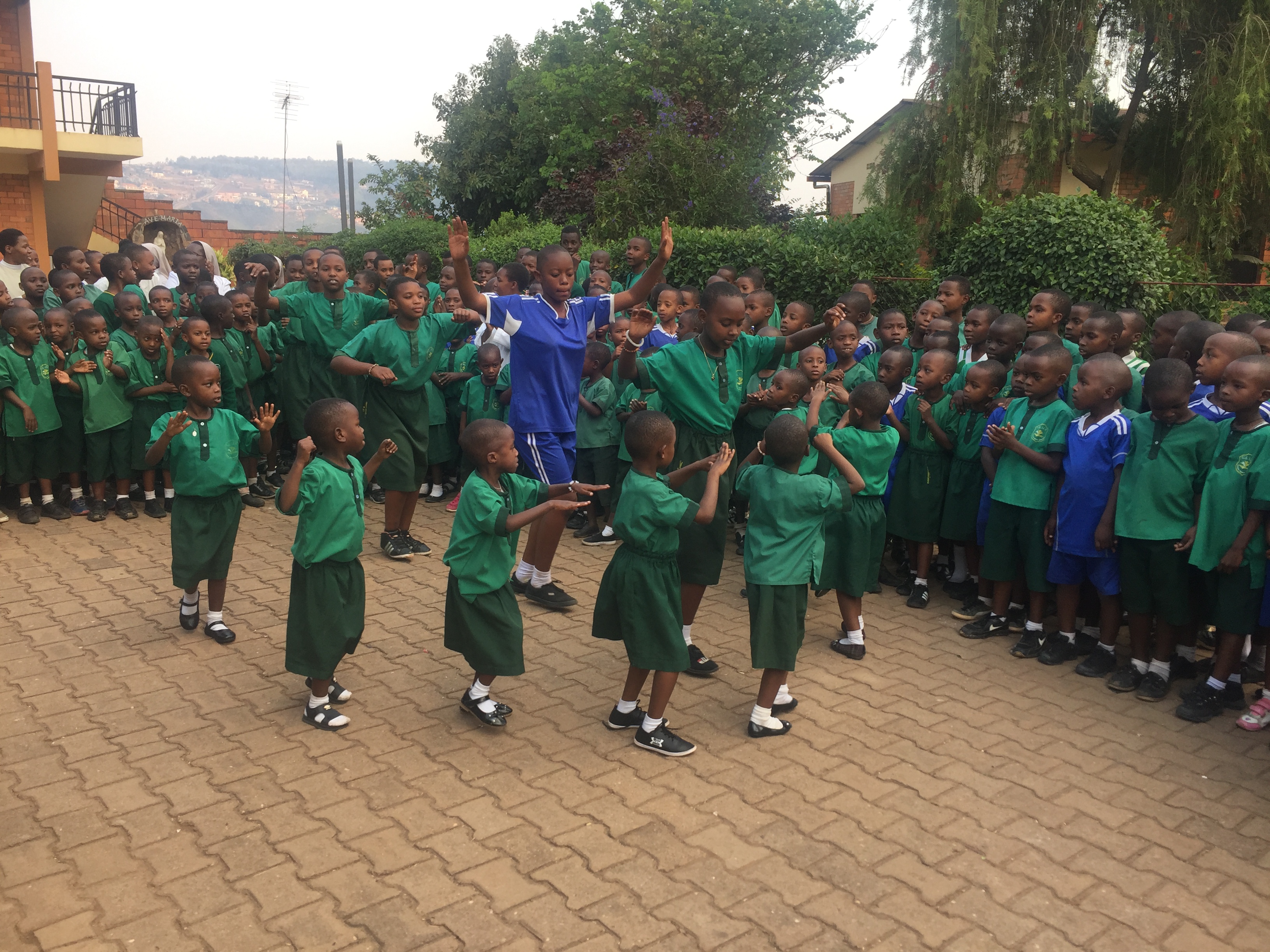 students dancing in circle at school